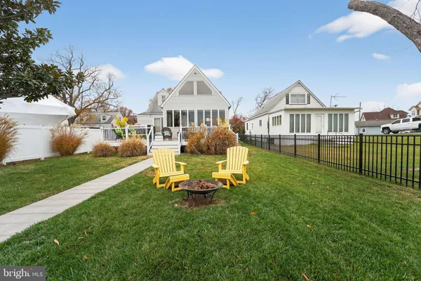 a view of a house with a yard porch and sitting area
