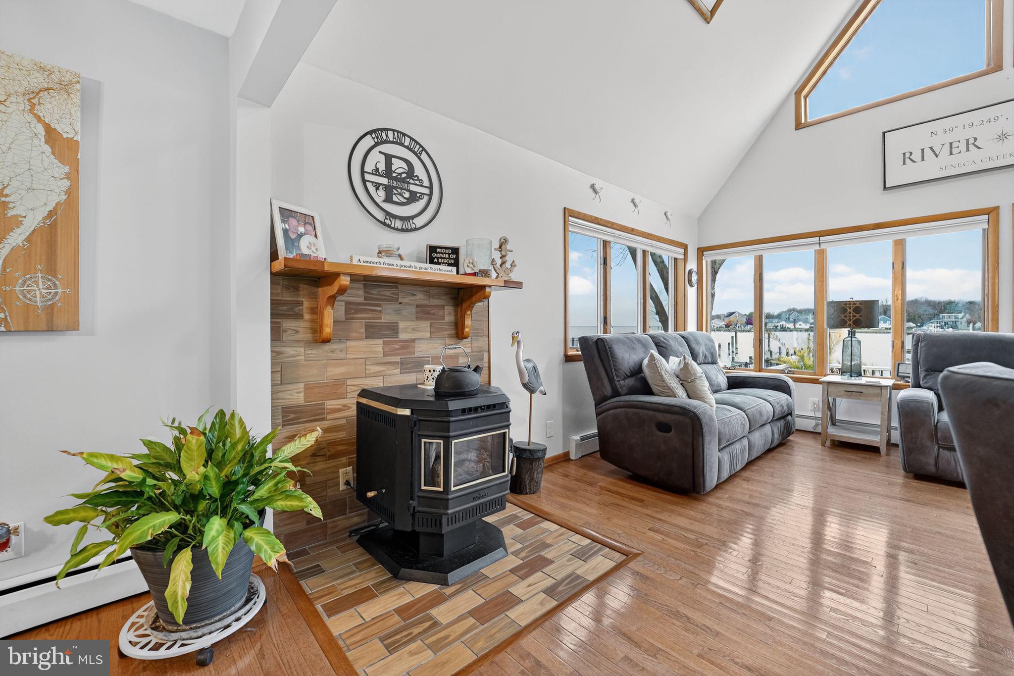 920 Seneca Park Road Middle River, MD 21220 - Photo 33 of 60 a living room with furniture and a floor to ceiling window