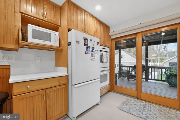 a living room with furniture fireplace and wooden floor