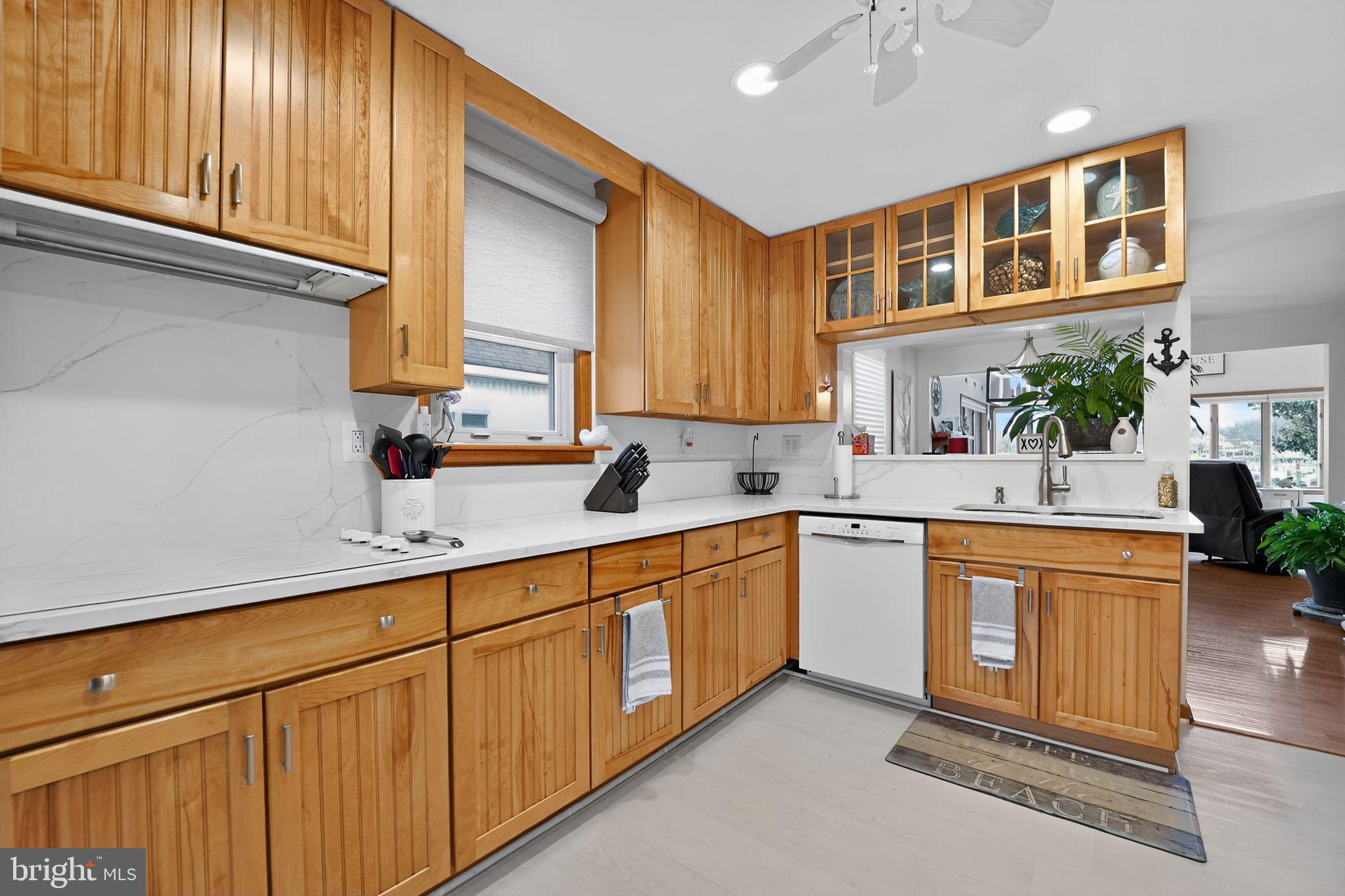 920 Seneca Park Road Middle River, MD 21220 - Photo 38 of 60 a kitchen with stainless steel appliances granite countertop a sink and cabinets