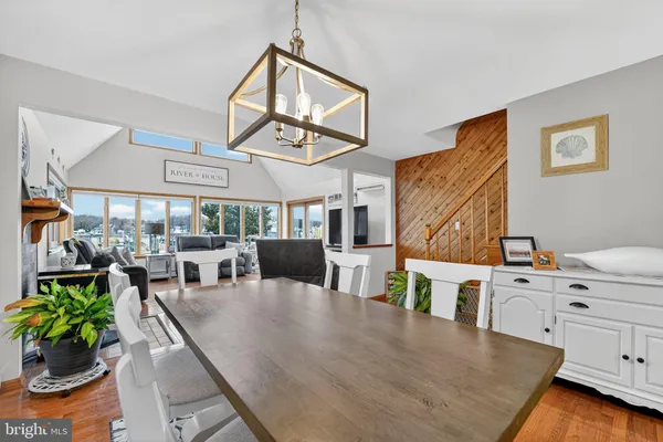 a spacious bedroom with a bed and a chandelier