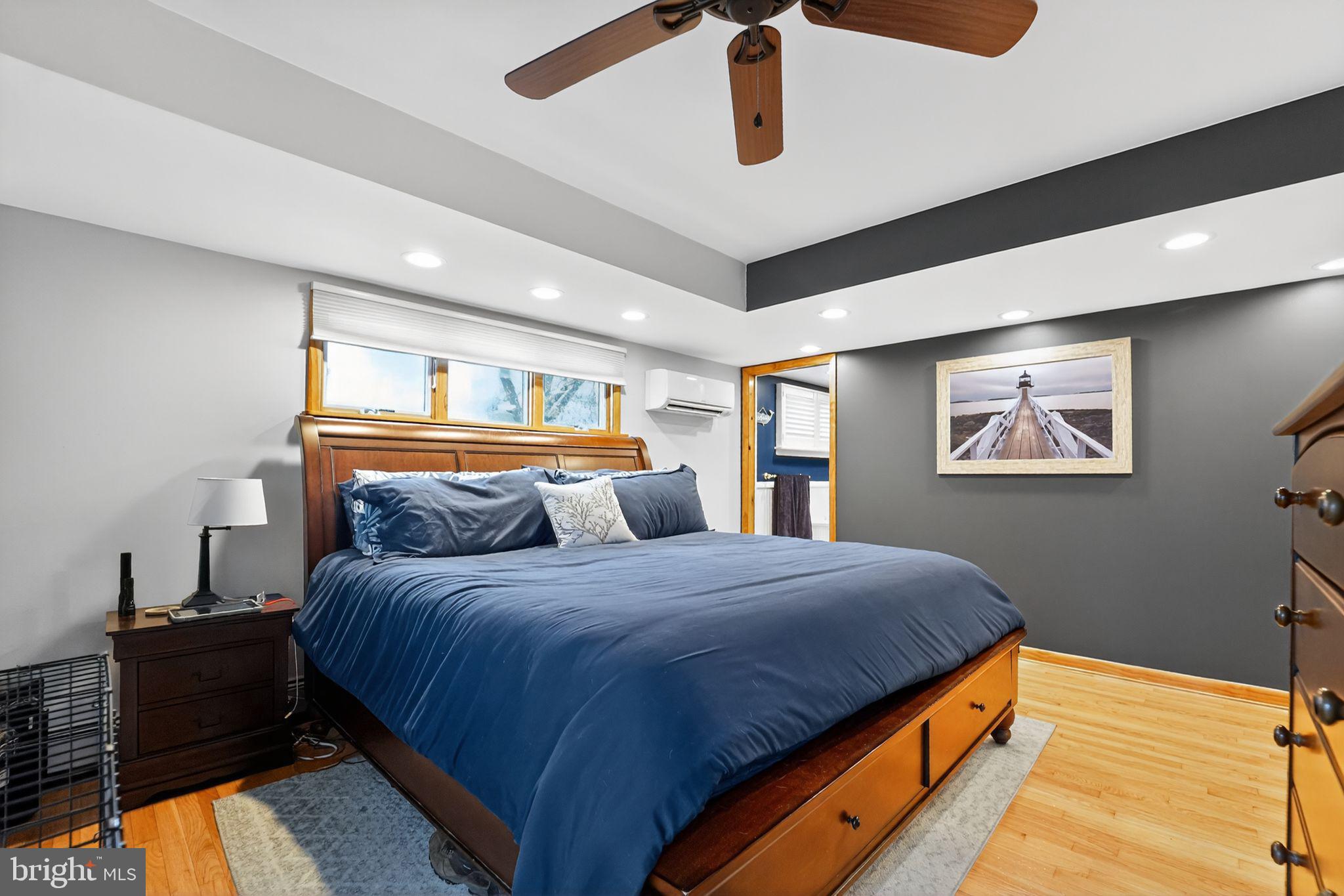 920 Seneca Park Road Middle River, MD 21220 - Photo 46 of 60 a bedroom with a bed and lamp with view