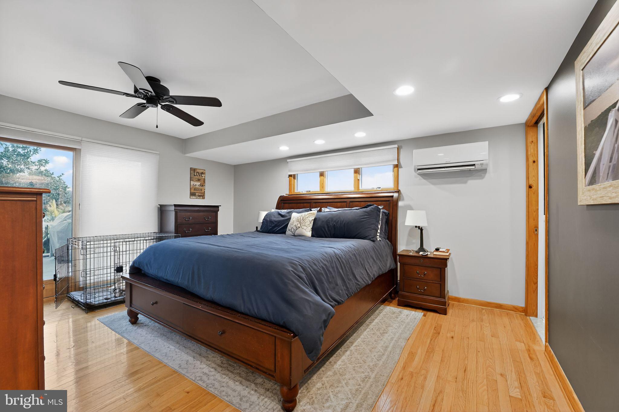 920 Seneca Park Road Middle River, MD 21220 - Photo 47 of 60 a spacious bedroom with a bed and a chandelier