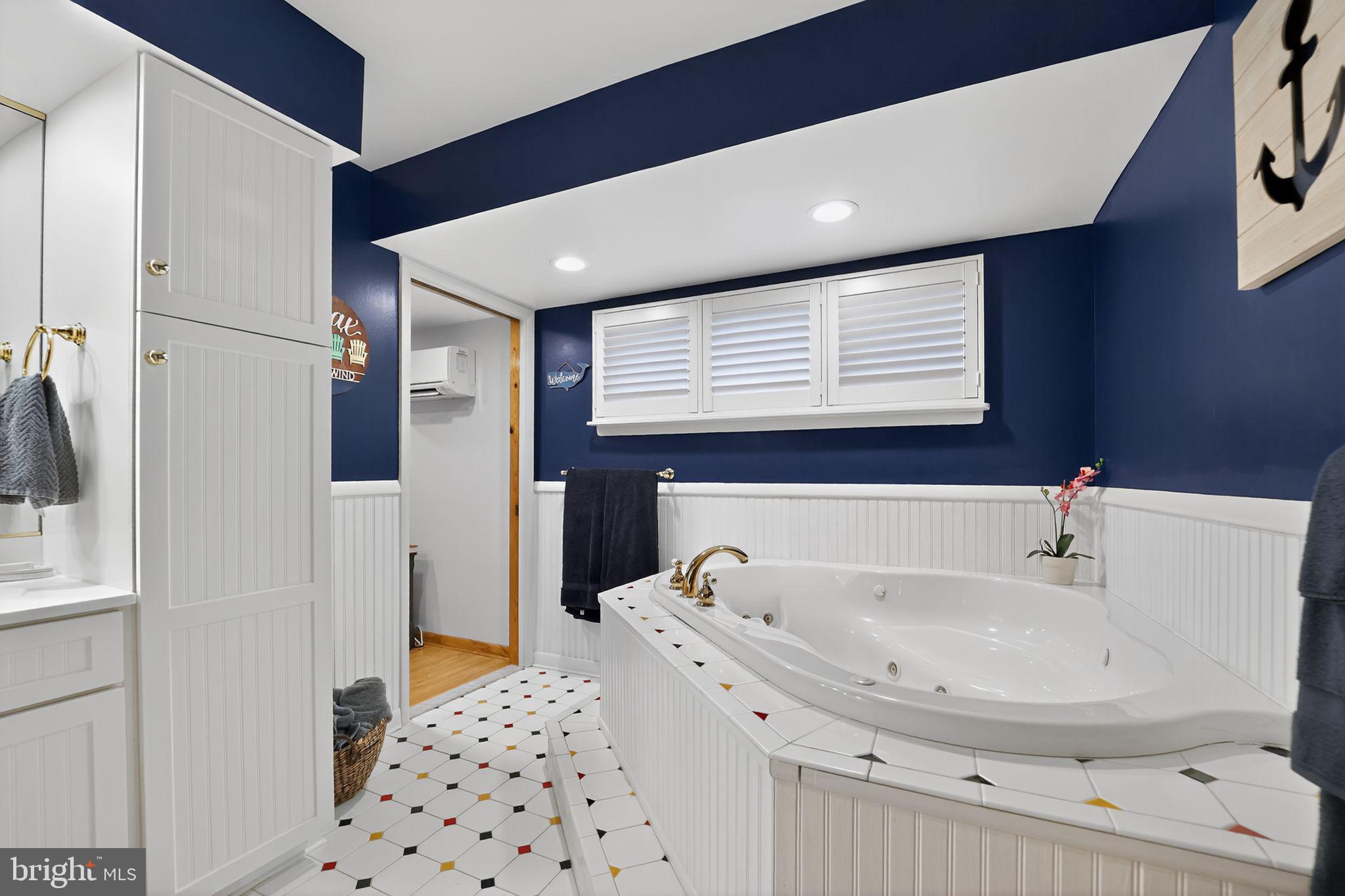 920 Seneca Park Road Middle River, MD 21220 - Photo 48 of 60 a bathroom with a bathtub and next to a window