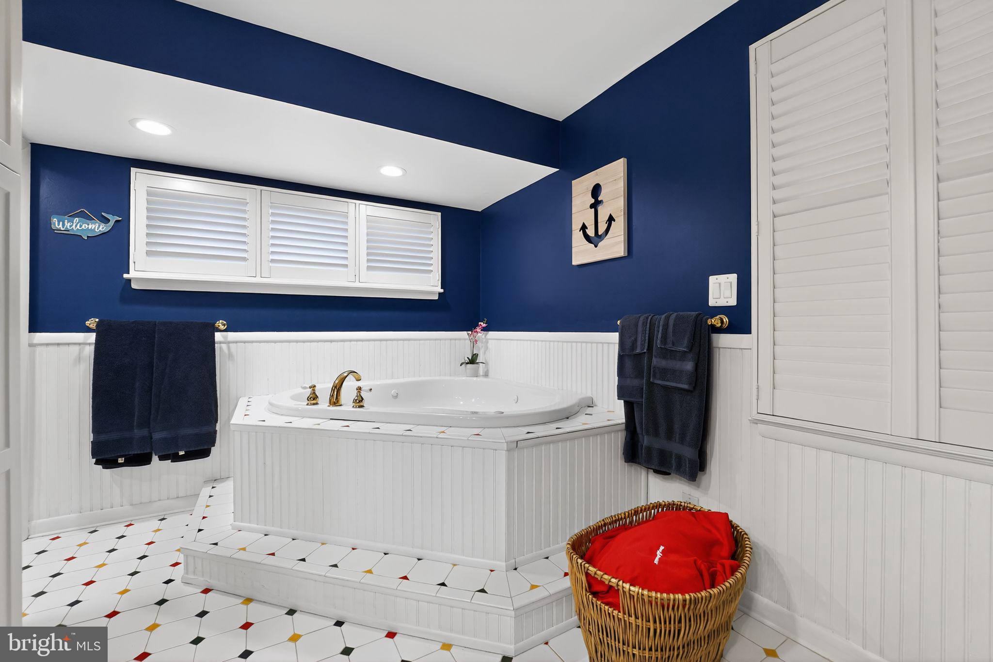 920 Seneca Park Road Middle River, MD 21220 - Photo 49 of 60 a bathroom with a sink toilet vanity and tub