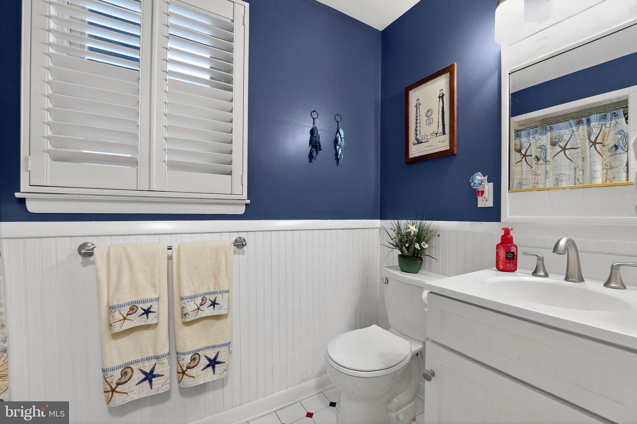 920 Seneca Park Road Middle River, MD 21220 - Photo 50 of 60 a bathroom with a toilet sink and mirror