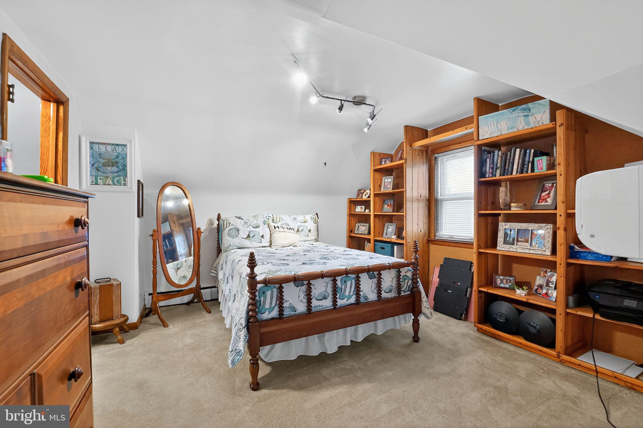 920 Seneca Park Road Middle River, MD 21220 - Photo 56 of 60 a bedroom with furniture and a book shelf