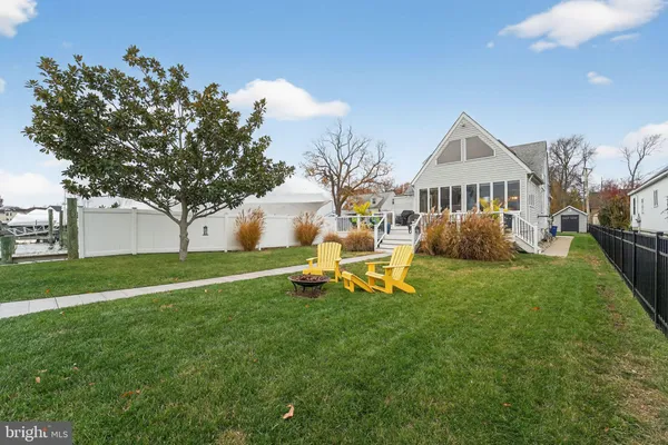 a view of a house with a yard porch and sitting area