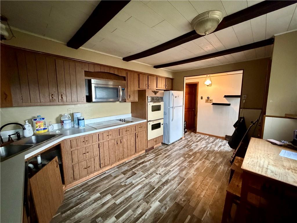 118 Ida Avenue Donora, PA 15033 - Photo 6 of 18 a kitchen with a refrigerator and a stove top oven
