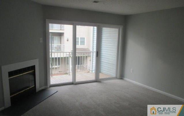 824 Edpas Road, Unit 824 New Brunswick, NJ 08901 - Photo 5 of 11 a view of empty room with floor to ceiling window