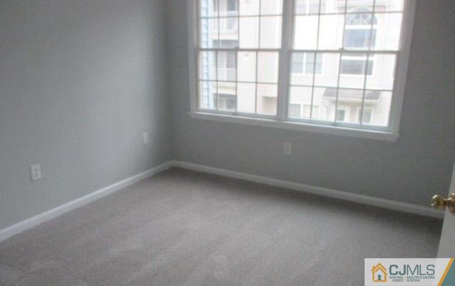 824 Edpas Road, Unit 824 New Brunswick, NJ 08901 - Photo 6 of 11 an empty room with a window