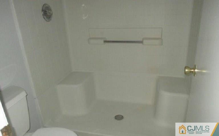 824 Edpas Road, Unit 824 New Brunswick, NJ 08901 - Photo 10 of 11 a bathroom with a shower and toilet