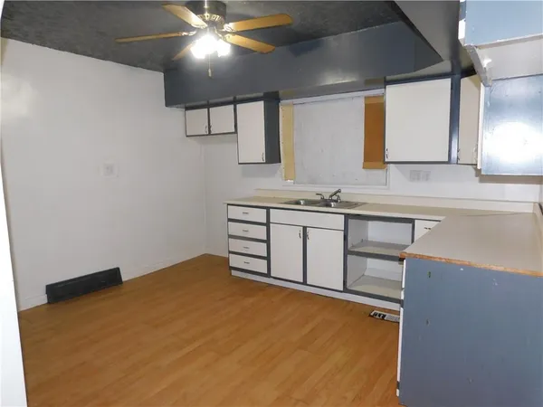 a bathroom with a sink vanity and a mirror