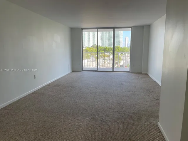 a view of a park with large trees and a big yard
