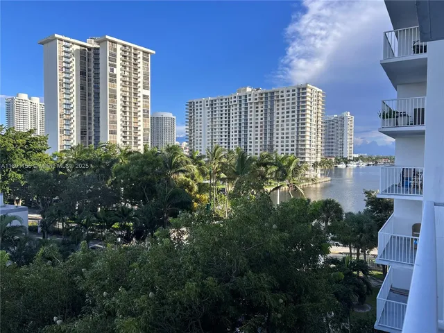 a view of a city with tall buildings