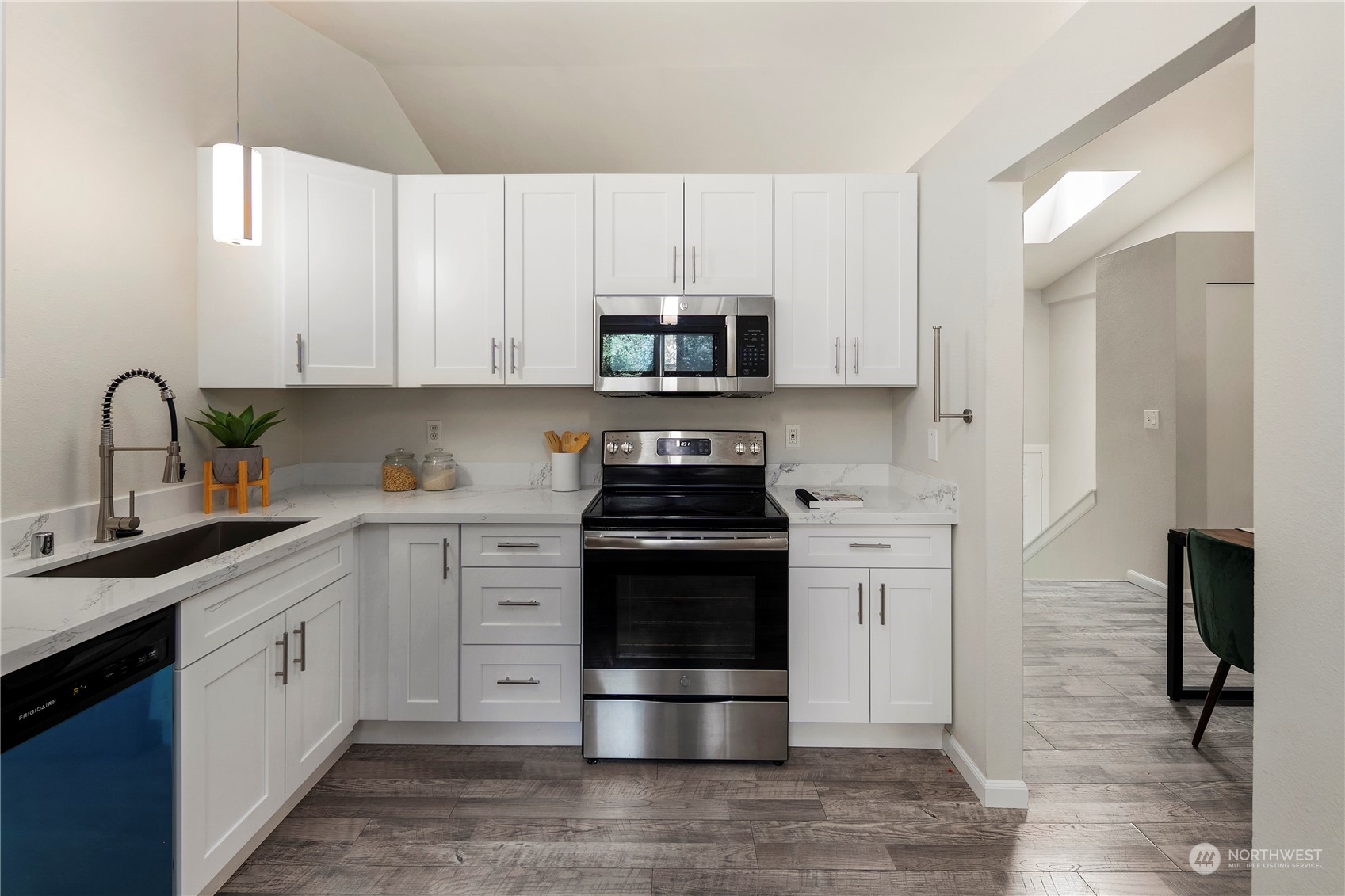 23019 20th Avenue Southeast Bothell, WA 98021 - Photo 12 of 34 a kitchen with stainless steel appliances granite countertop a stove and a refrigerator