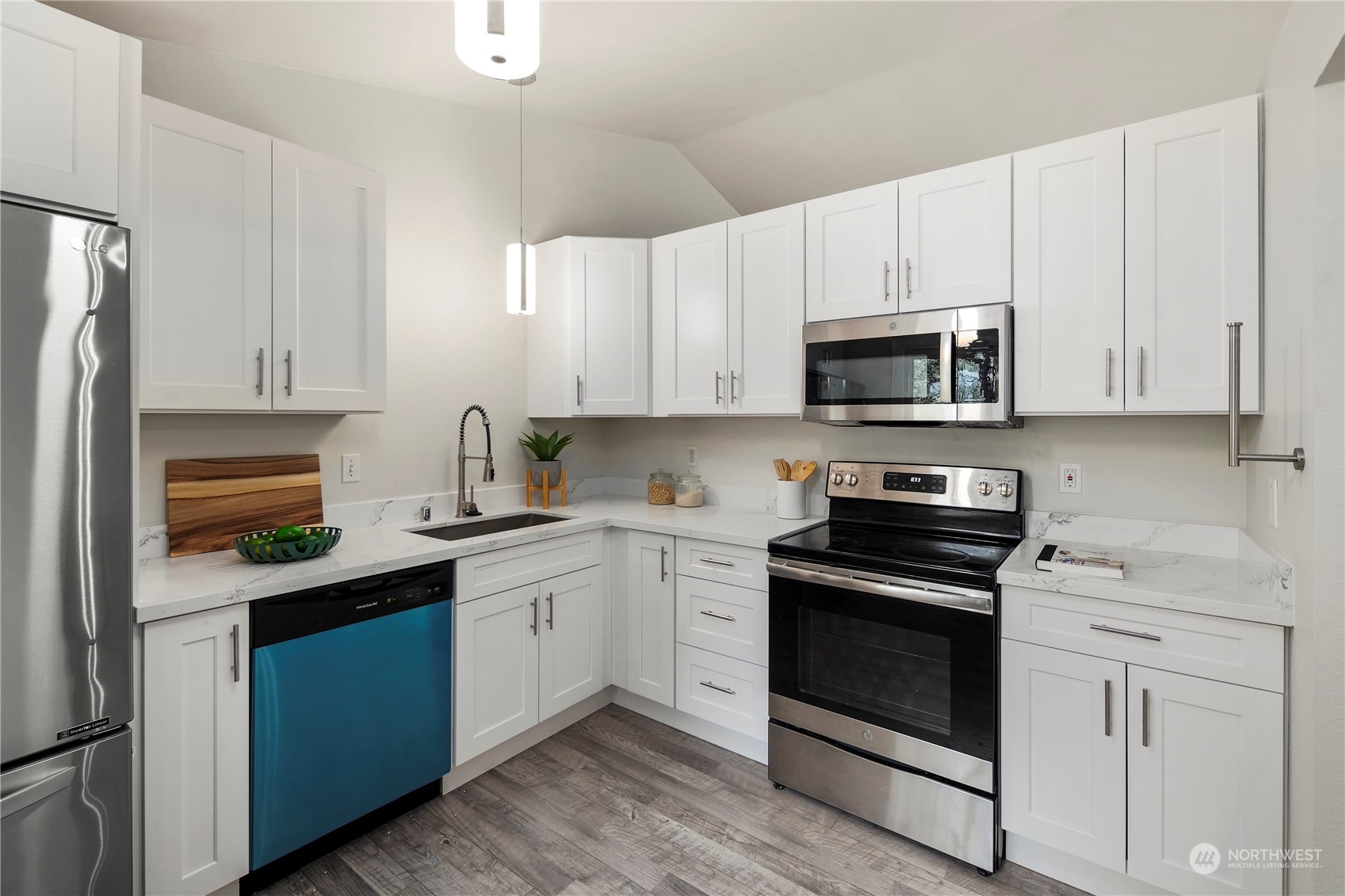 23019 20th Avenue Southeast Bothell, WA 98021 - Photo 13 of 34 a kitchen with cabinets stainless steel appliances a sink and a counter space