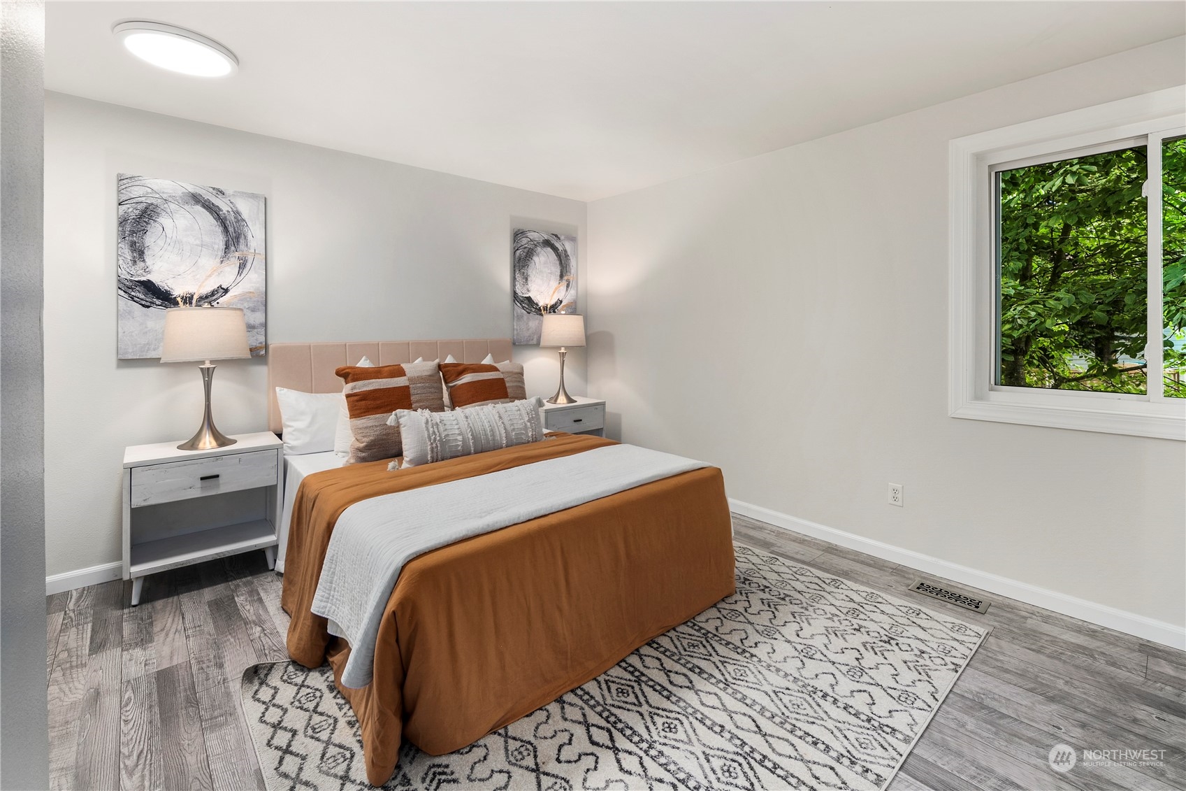 23019 20th Avenue Southeast Bothell, WA 98021 - Photo 18 of 34 a bedroom with a bed and wooden floor