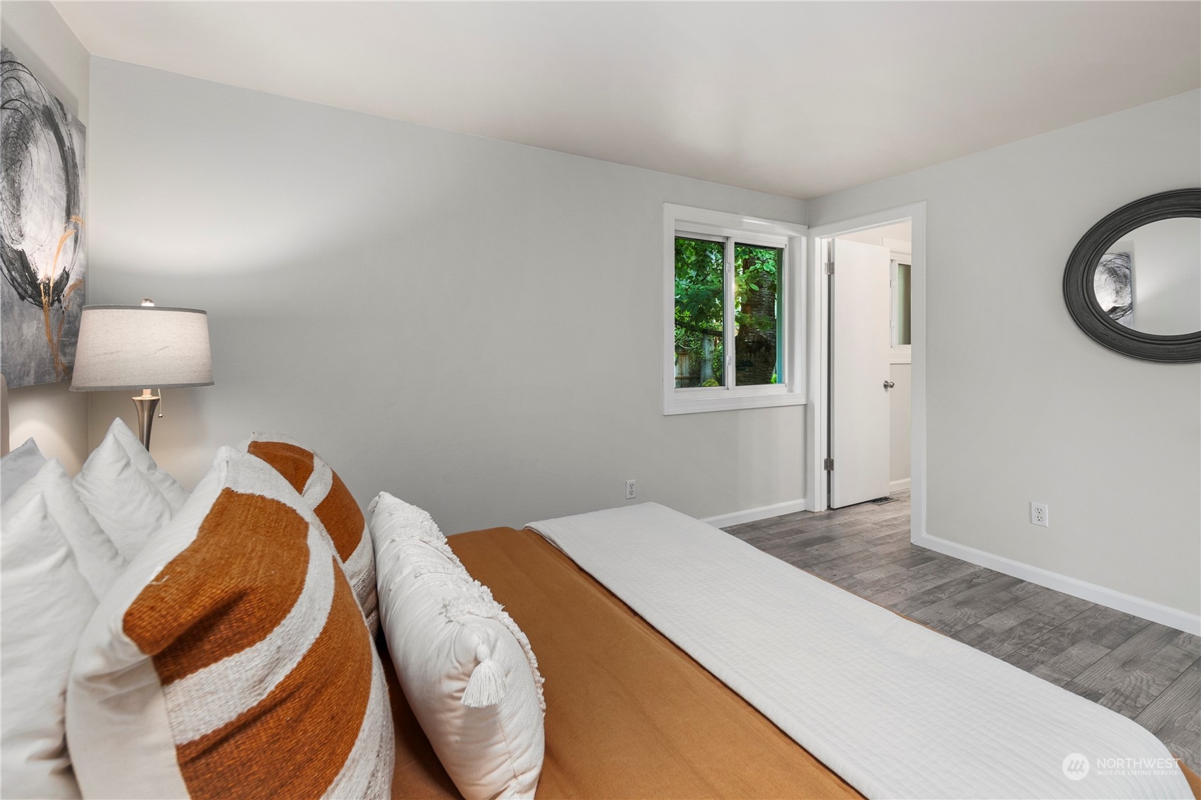 23019 20th Avenue Southeast Bothell, WA 98021 - Photo 20 of 34 a bedroom with a bed and a lamp