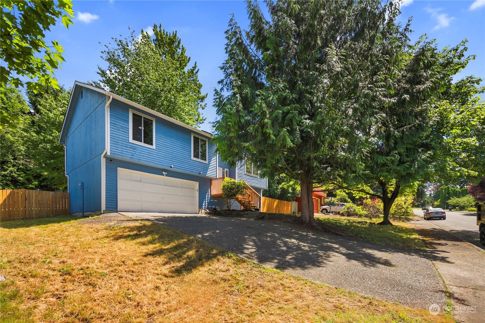 23019 20th Avenue Southeast Bothell, WA 98021 - Photo 2 of 34 a front view of a house with a yard