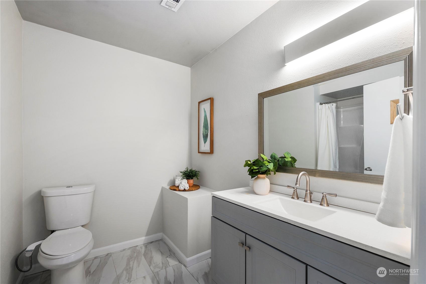23019 20th Avenue Southeast Bothell, WA 98021 - Photo 27 of 34 a bathroom with a sink toilet and mirror
