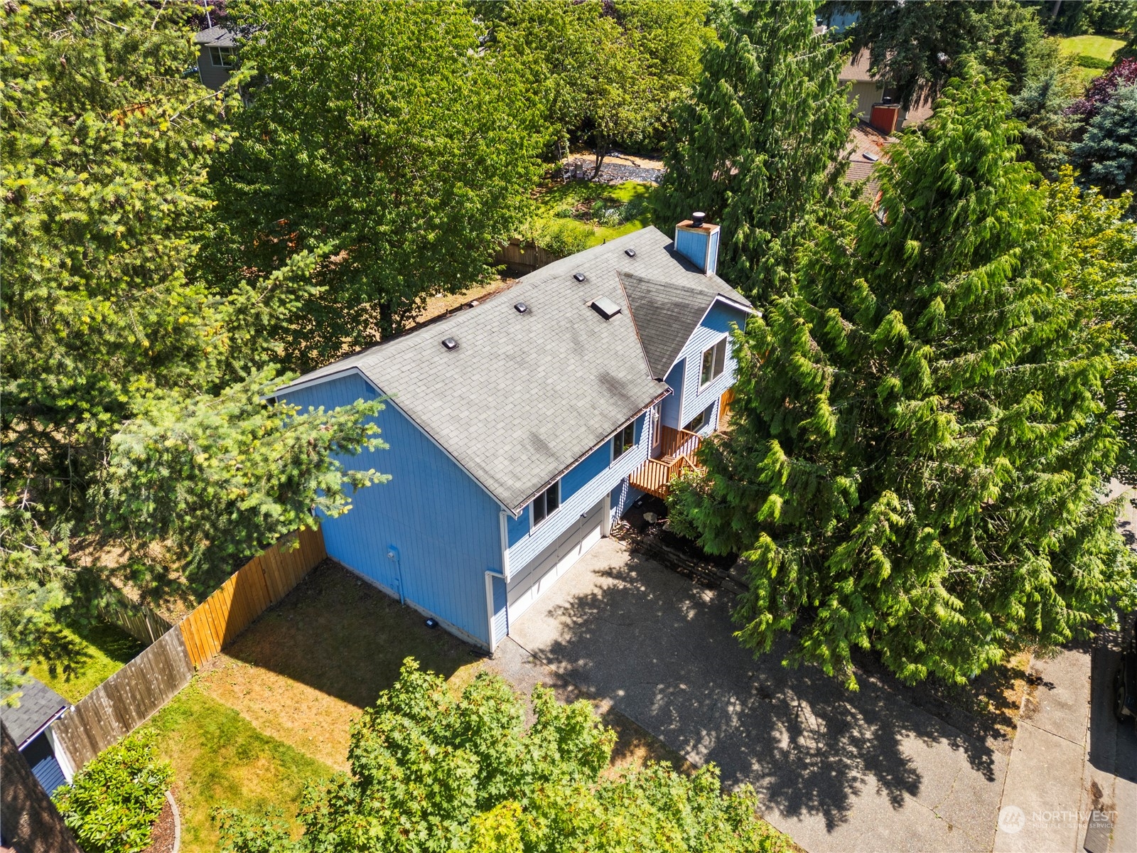 23019 20th Avenue Southeast Bothell, WA 98021 - Photo 30 of 34 view of a house with a yard and large trees