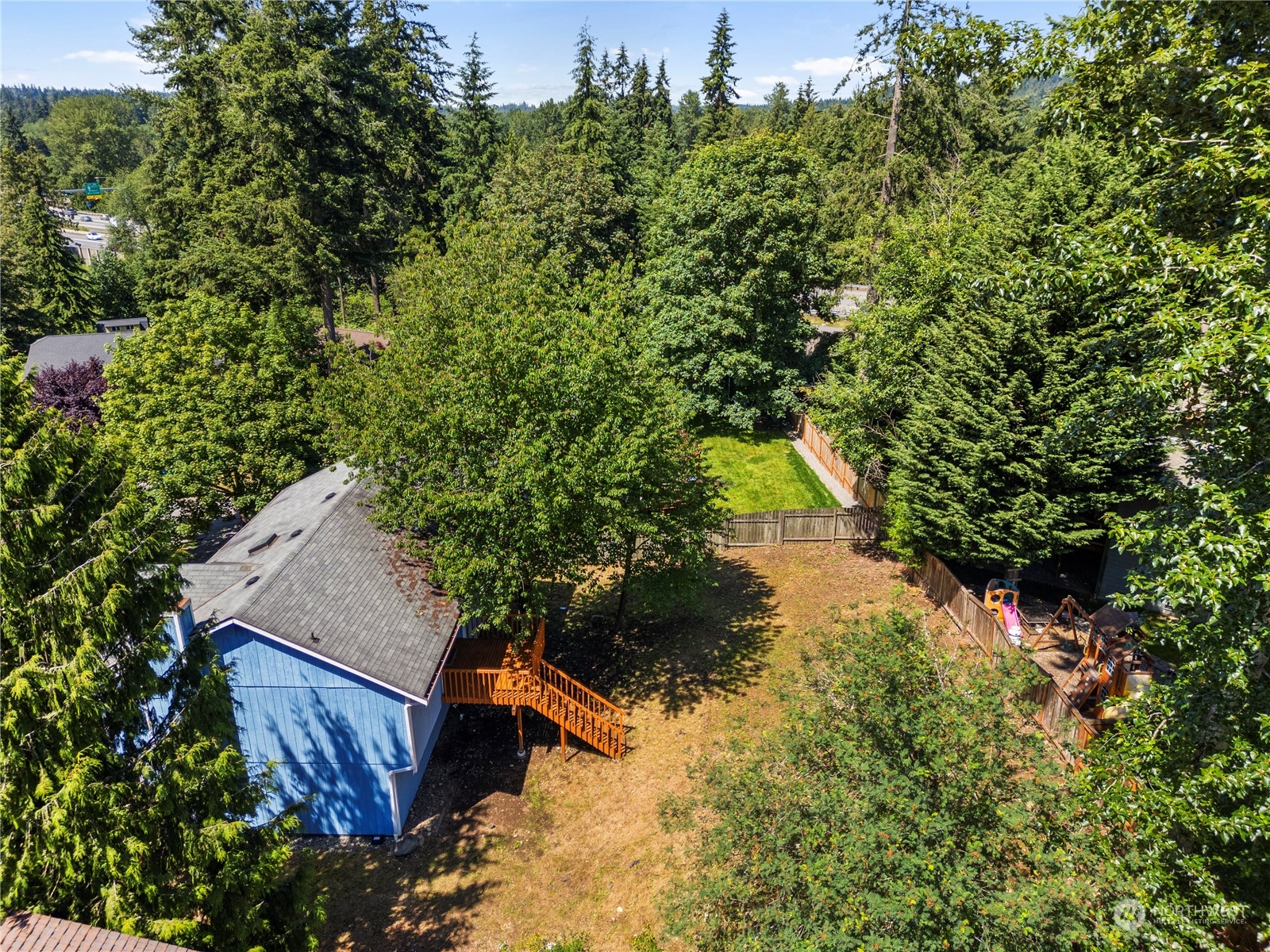 23019 20th Avenue Southeast Bothell, WA 98021 - Photo 31 of 34 a view of a house with a yard and a tree