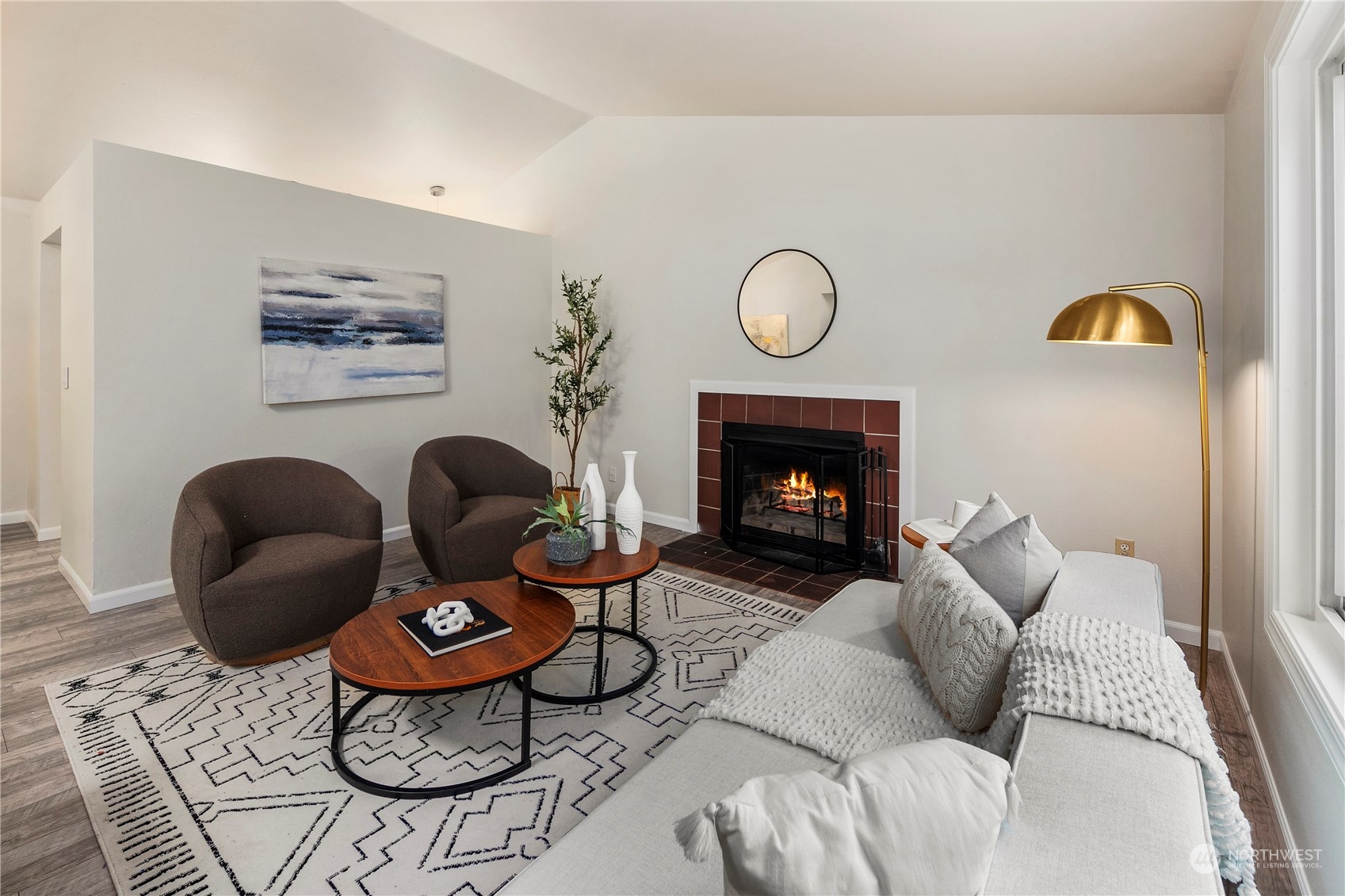 23019 20th Avenue Southeast Bothell, WA 98021 - Photo 6 of 34 a living room with furniture a rug and a fireplace