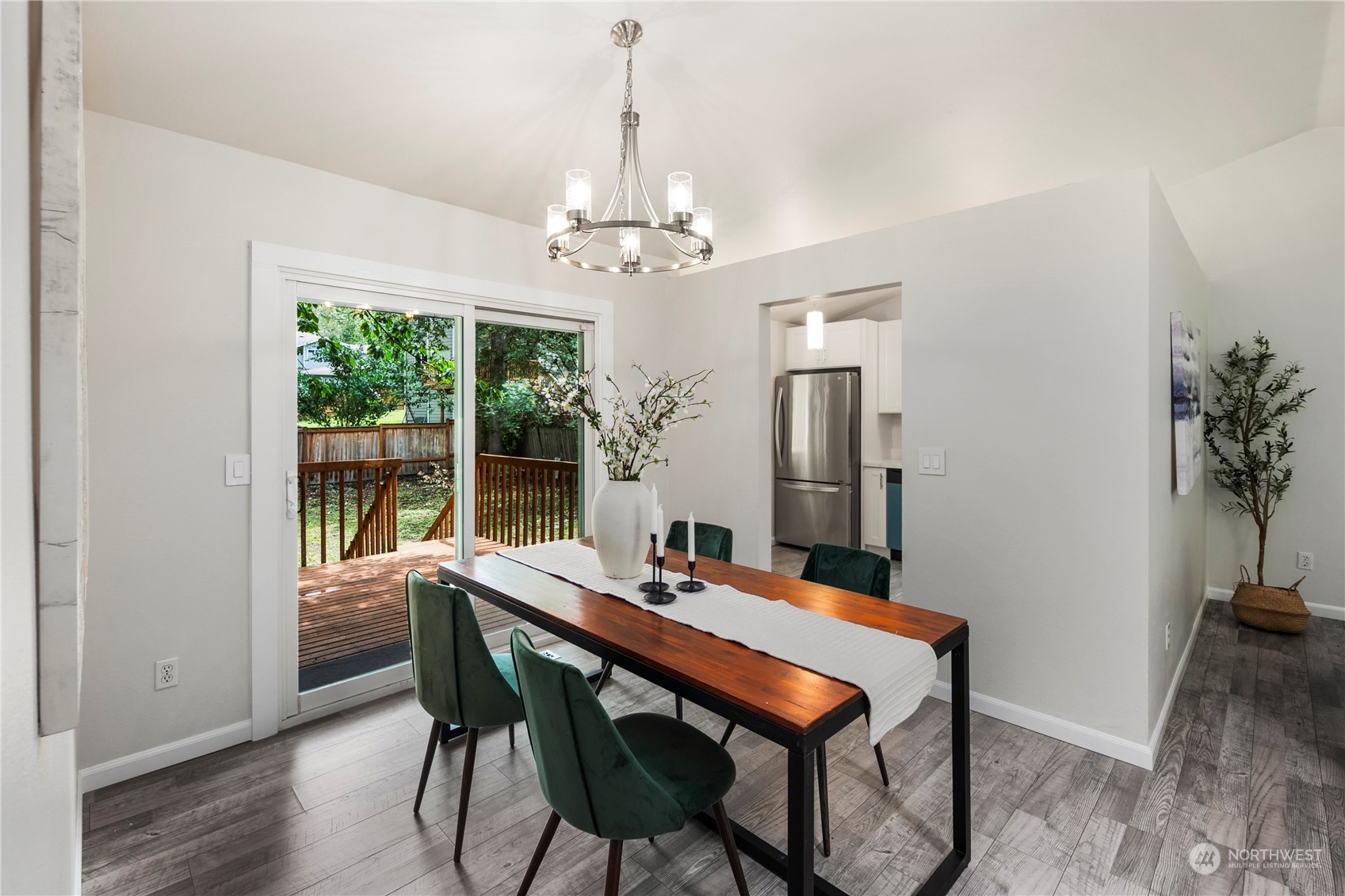 23019 20th Avenue Southeast Bothell, WA 98021 - Photo 10 of 34 a view of a dining room with furniture window and wooden floor
