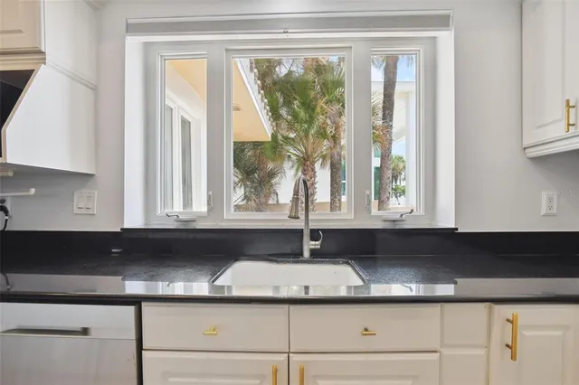 a kitchen with a sink and a window