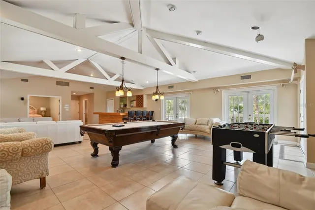 a bedroom with a bed and a mirror