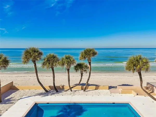 a view of a swimming pool with a patio