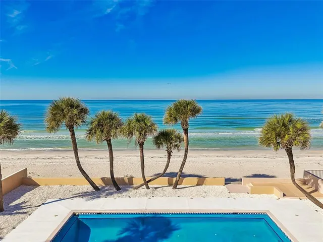 a view of a swimming pool with a patio