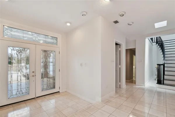 a view of an empty room with glass door