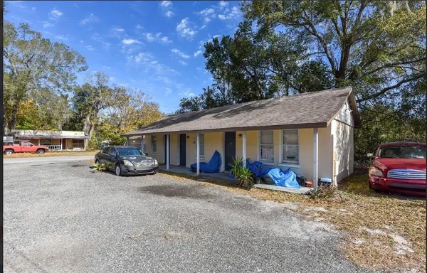 a view of a car park in front of house