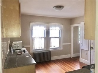 107 Wrentham Street, Unit 2 Boston, MA 02124 - Photo 11 of 11 a room with furniture and a window