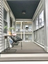 107 Wrentham Street, Unit 2 Boston, MA 02124 - Photo 2 of 11 a view of a living room and kitchen with furniture