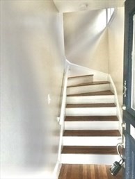 107 Wrentham Street, Unit 2 Boston, MA 02124 - Photo 3 of 11 a view of staircase with white walls