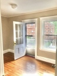 107 Wrentham Street, Unit 2 Boston, MA 02124 - Photo 5 of 11 a view of an empty room with a window