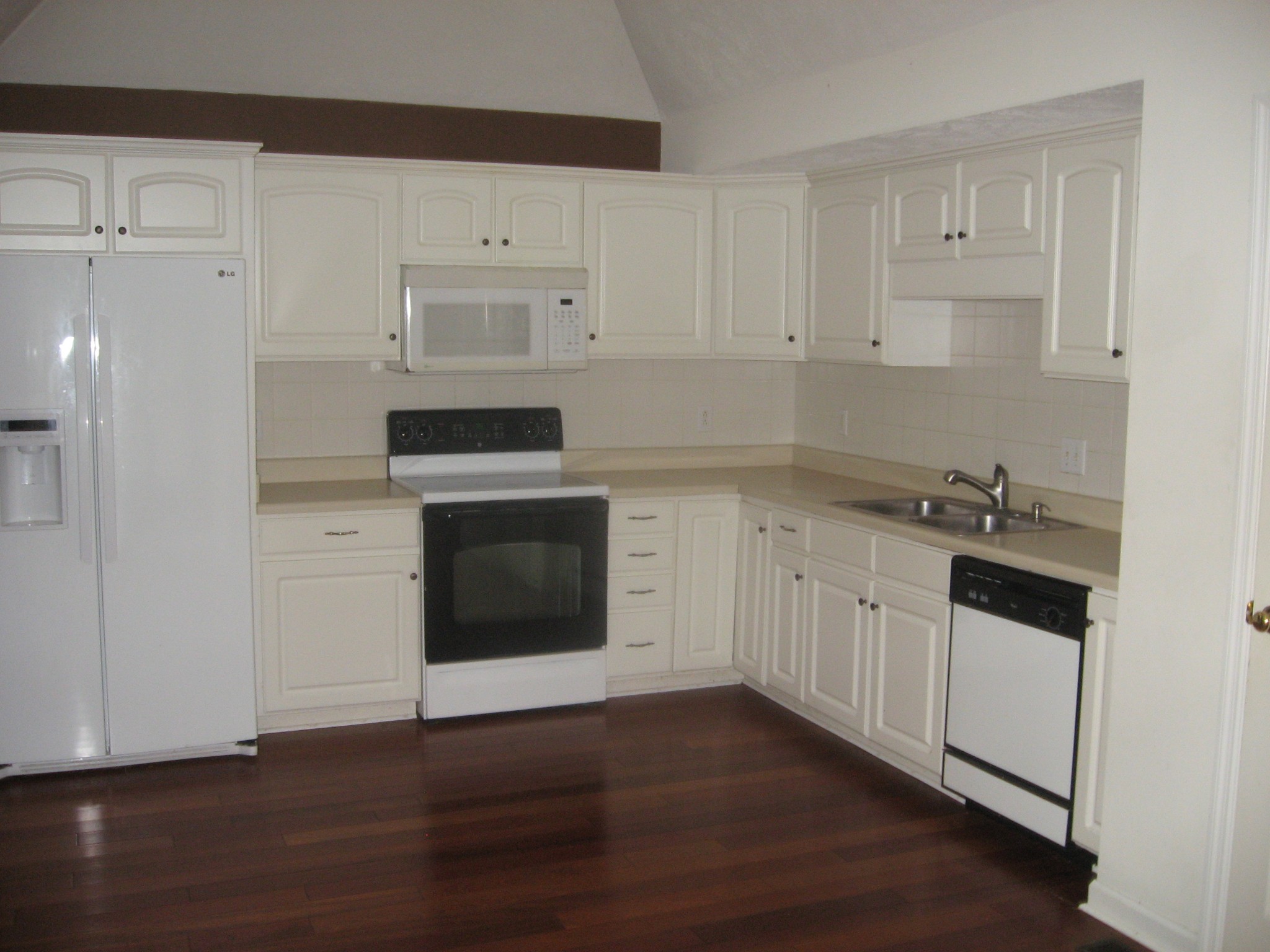 131 Savannah Ridge Murfreesboro, TN 37127 - Photo 2 of 9 a kitchen with granite countertop white cabinets and white appliances