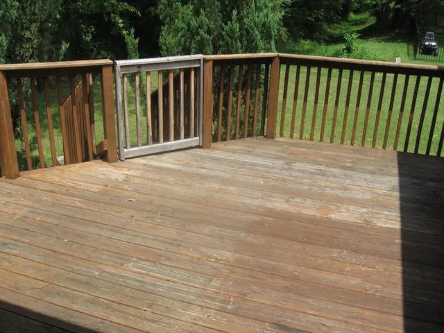 a view of balcony with wooden floor