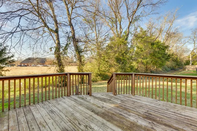 a view of balcony with wooden floor