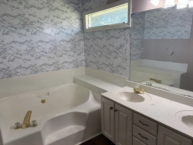 a bathroom with a sink and a bathtub