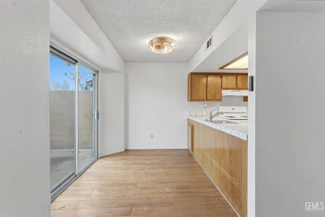 a bathroom with a sink a mirror and a bathtub