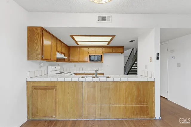 a bathroom with a sink a mirror and a bathtub