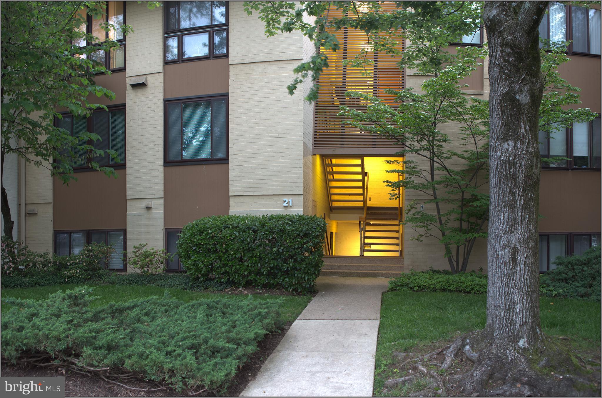21 Hamill Road, Unit 21F Baltimore, MD 21210 - Photo 1 of 28 a front view of a house with a yard