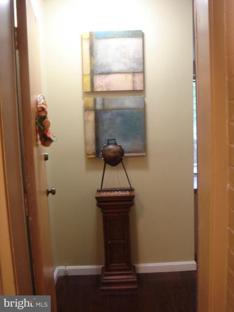 21 Hamill Road, Unit 21F Baltimore, MD 21210 - Photo 2 of 28 a view of hallway with wooden floor