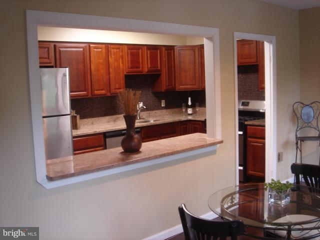 21 Hamill Road, Unit 21F Baltimore, MD 21210 - Photo 6 of 28 a view of a dining room with furniture window and outside view