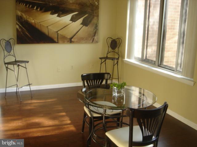 21 Hamill Road, Unit 21F Baltimore, MD 21210 - Photo 7 of 28 a dining room with furniture and window