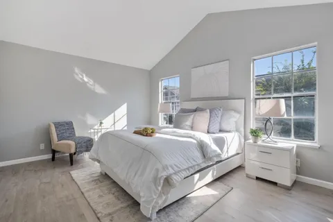 a bed room with bed and a window